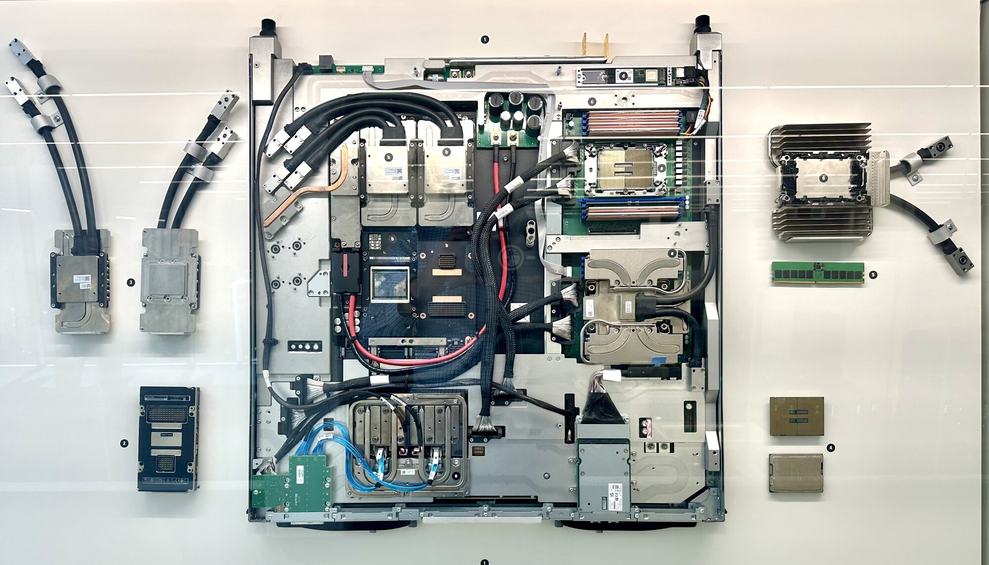 Opened GPU compute blade with liquid cooling, showing the dense packaging of GPU and CPU modules typical of accelerated HPC systems.